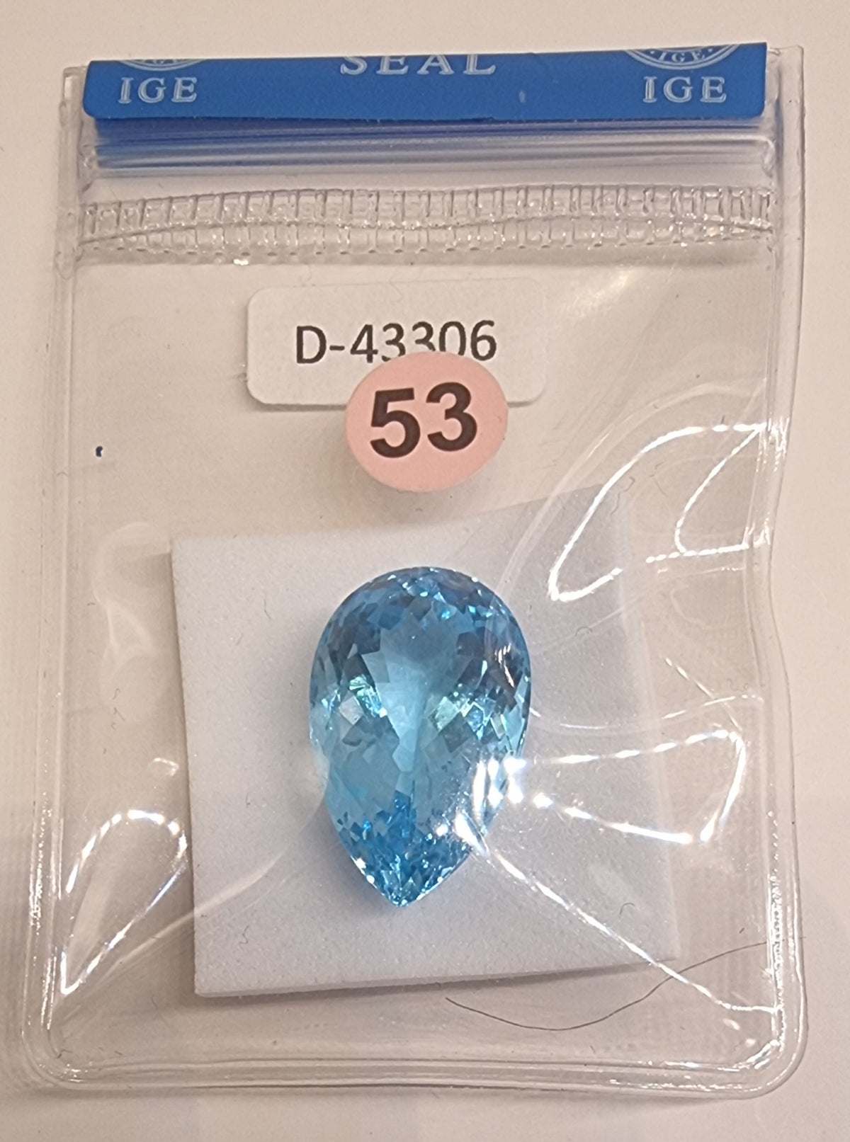 NATURLIG BLÅ TOPAS – PÆRESLIPT – 23,16 CT – IGE-RAPPORT